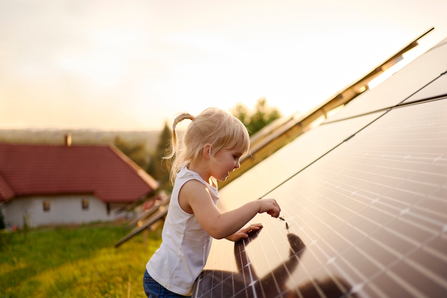 A girl admires some solar panels