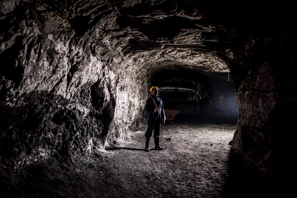 Man standing inside a undergound mine