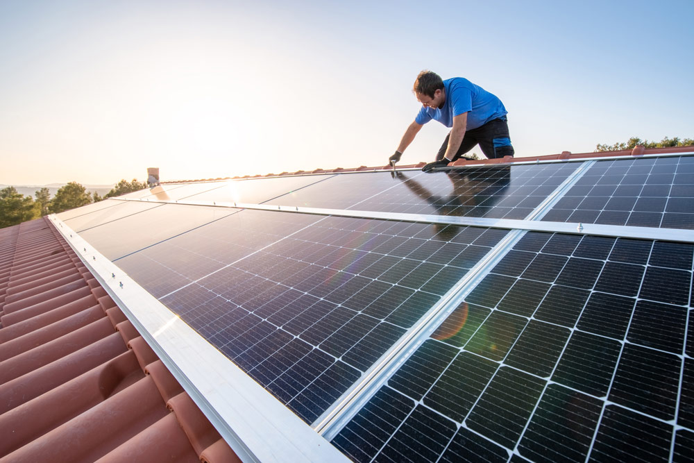 A person installing sunpanels